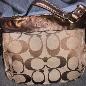 Brown and gold coach purse